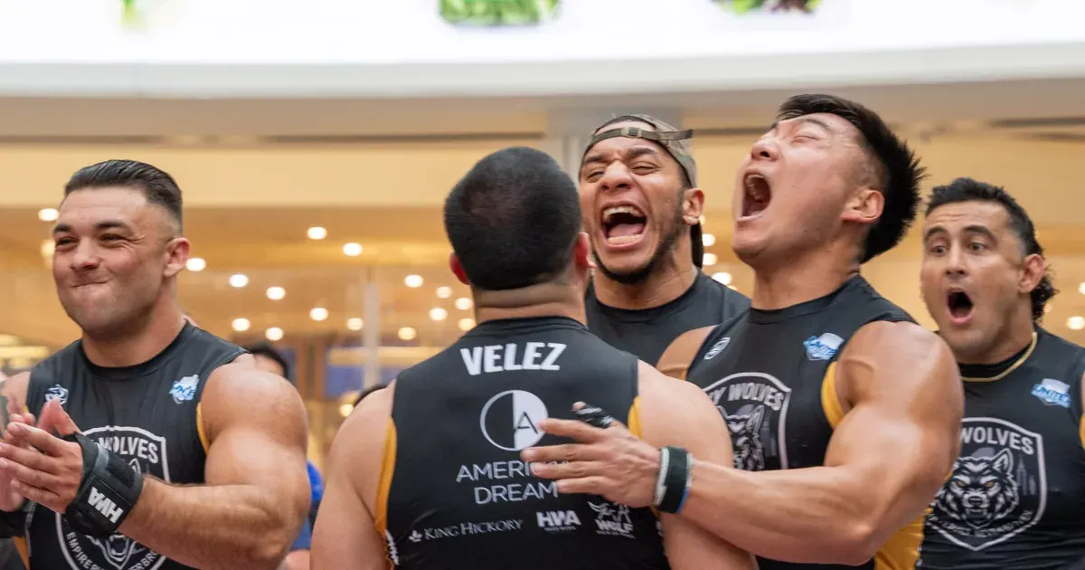 New York Wolves athletes celebrate a race win during United Grid League Week 3 at American Dream.
