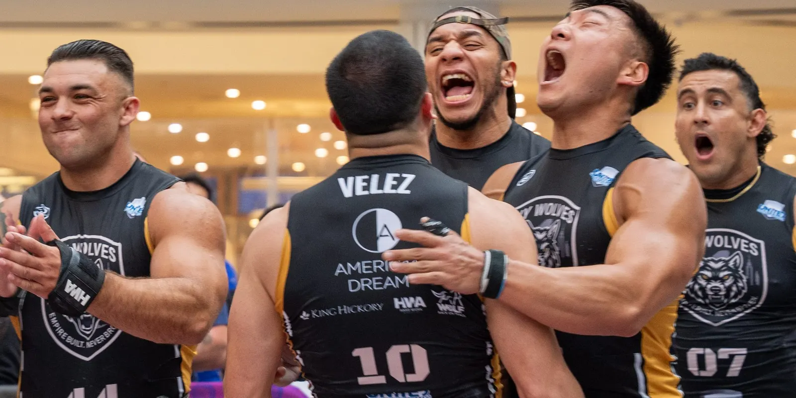 New York Wolves athletes celebrate on the competition floor at United Grid League Week 3 at American Dream.