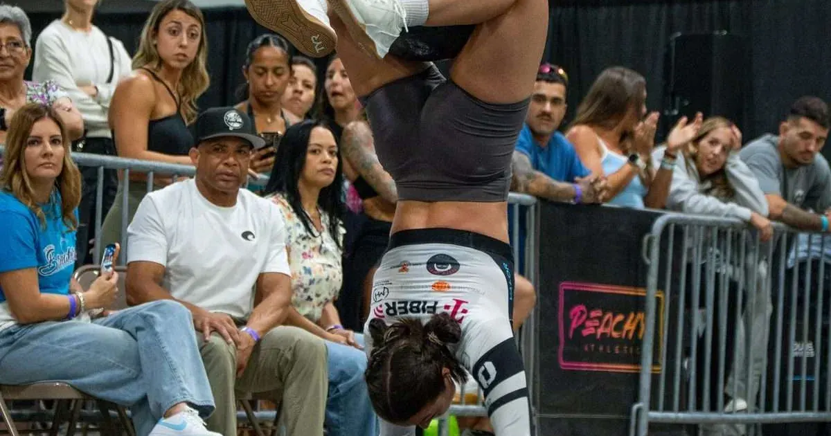 A Palm Beach Breakers player performs the med-ball handstand walk during the Breakers vs Sharks 2026 Grid League season opener in Miami