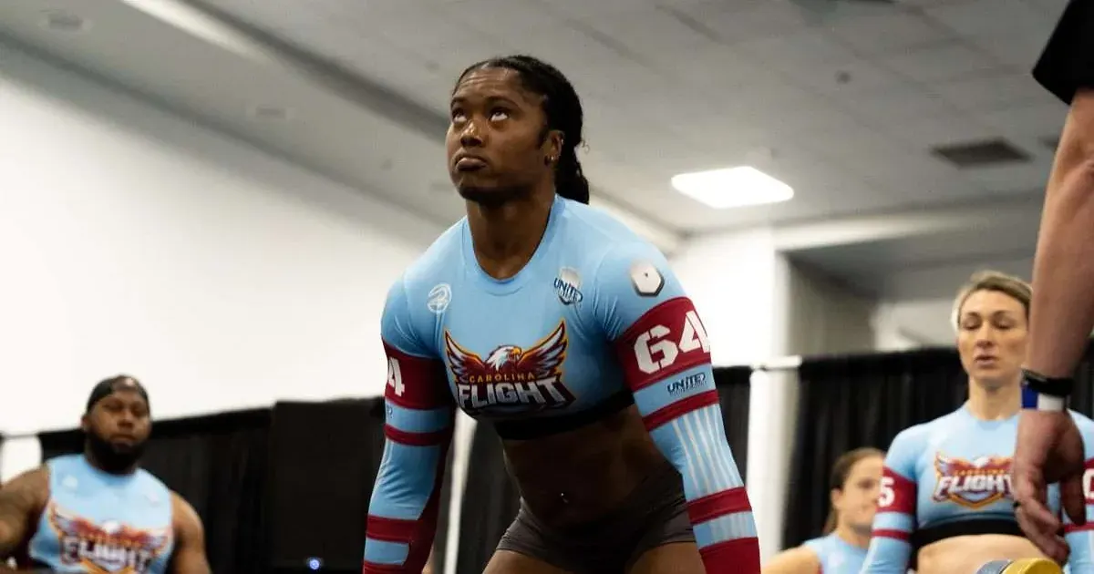 A Carolina Flight player lifts a barbell during their debut United Grid League match against the Houston Bandits in Lakeland, Florida, 2026.