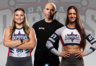 Dallas Deputies owners Jocelyn Williams, Joel Del Rosario and Rebecca Rouse in Dallas Deputies gear in front of the team logo