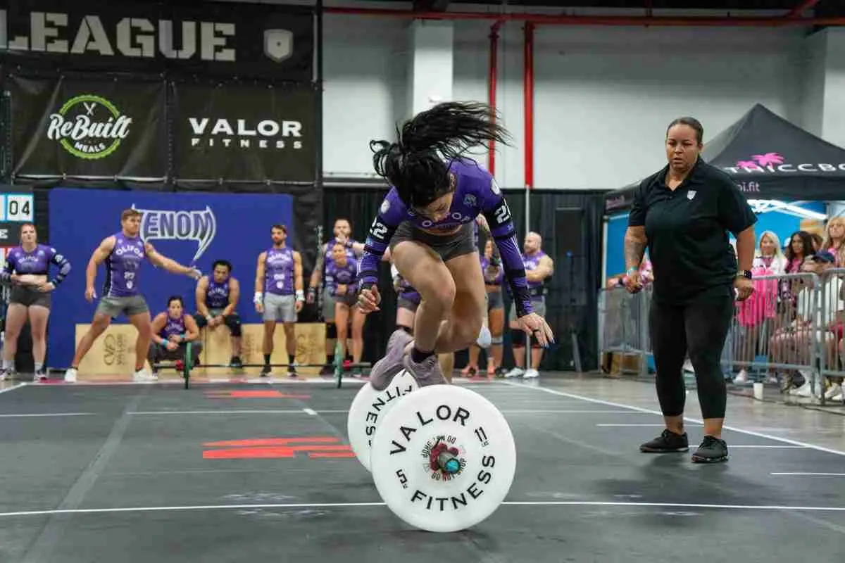 Las Vegas Venom utility player Danielle Berry jumps over the barbell on bar-facing burpees during the Wild vs Venom 2026 Grid League season opener in Miami