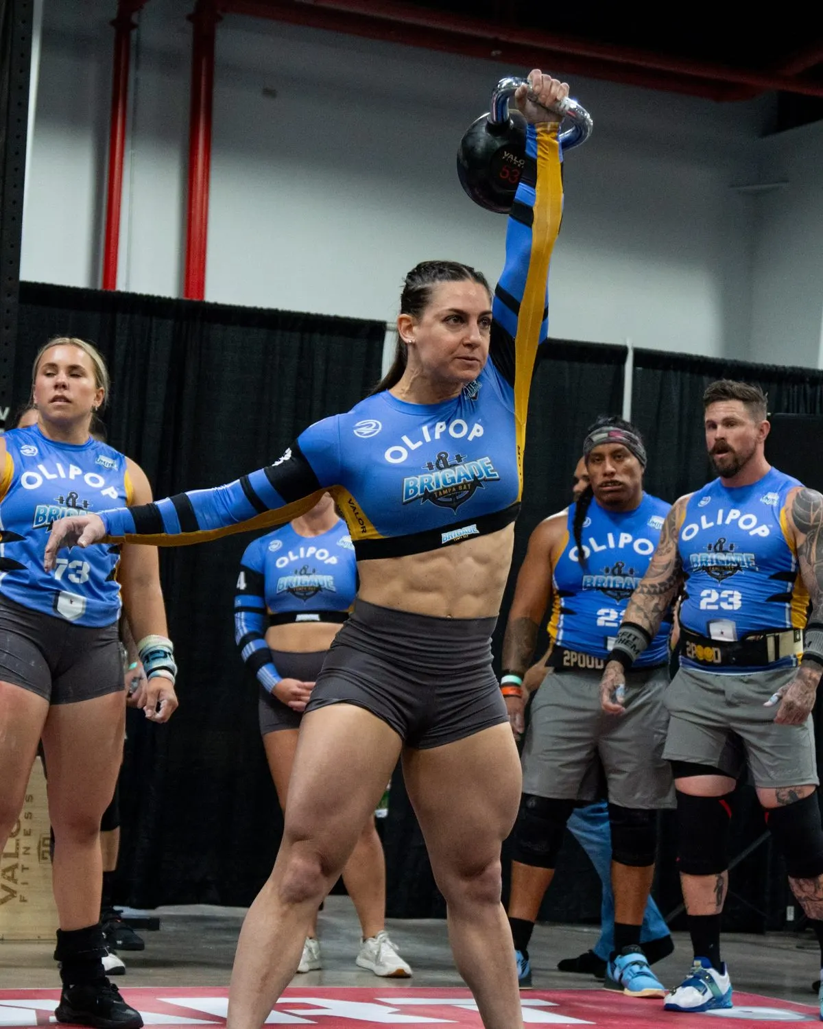 A Tampa Bay Brigade athlete drives a kettlebell overhead during a 2026 United Grid League match.