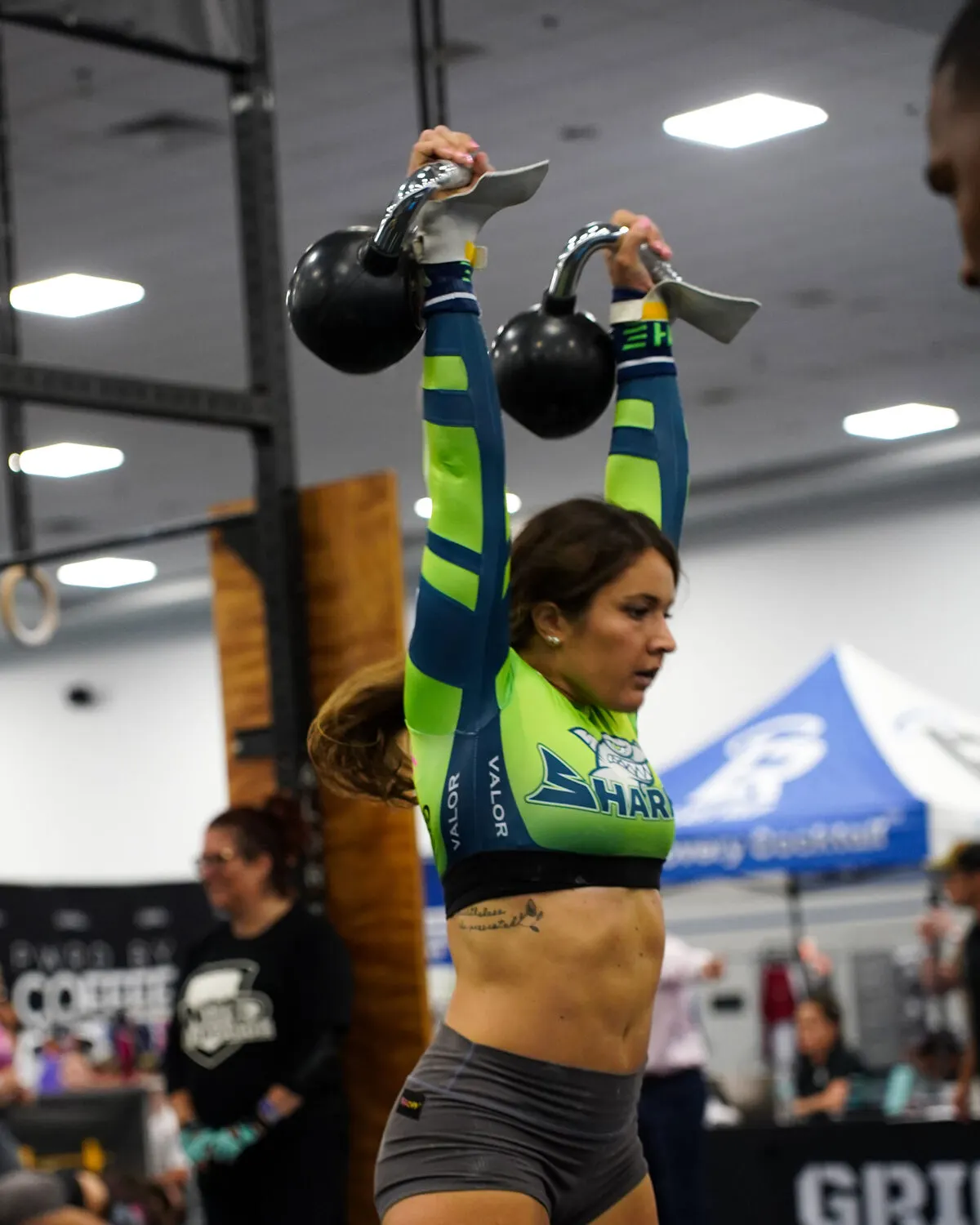 A Southwest Florida Sharks athlete locks out a double kettlebell overhead at the Grid League match in Lakeland on June 20, 2026.