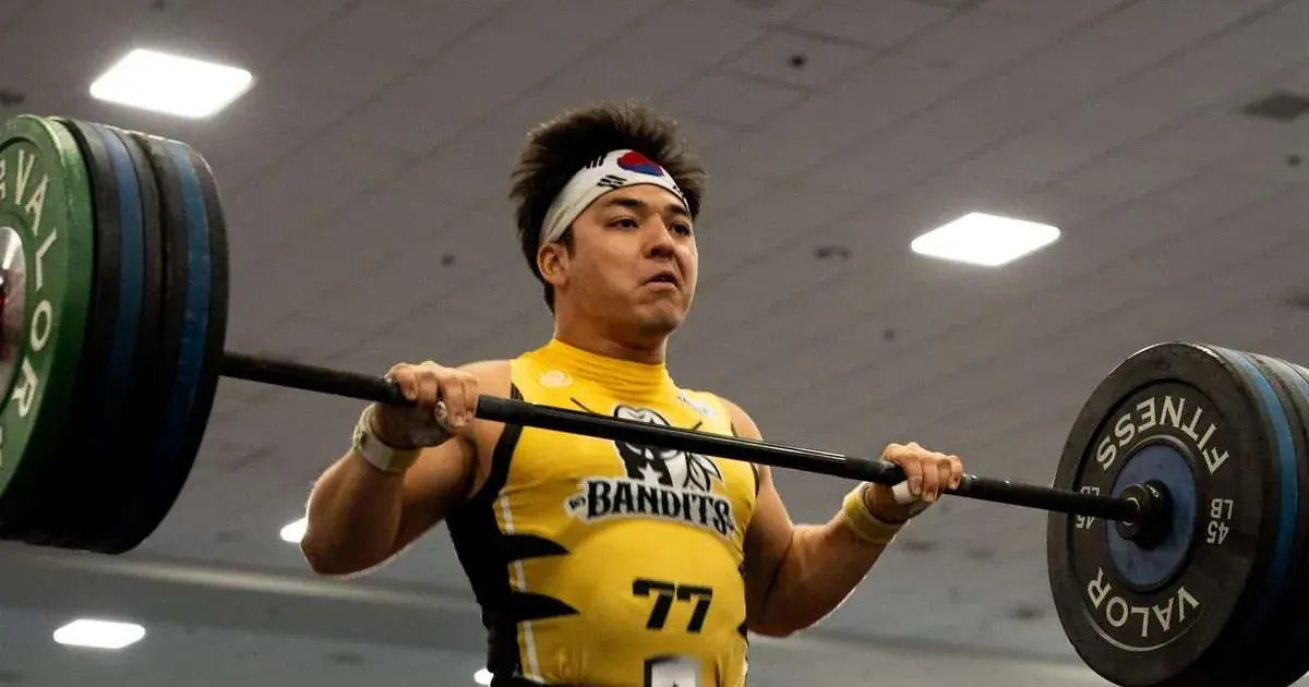 A Houston Bandits player cleans a barbell during their 2026 United Grid League match against the Carolina Flight in Lakeland, Florida.