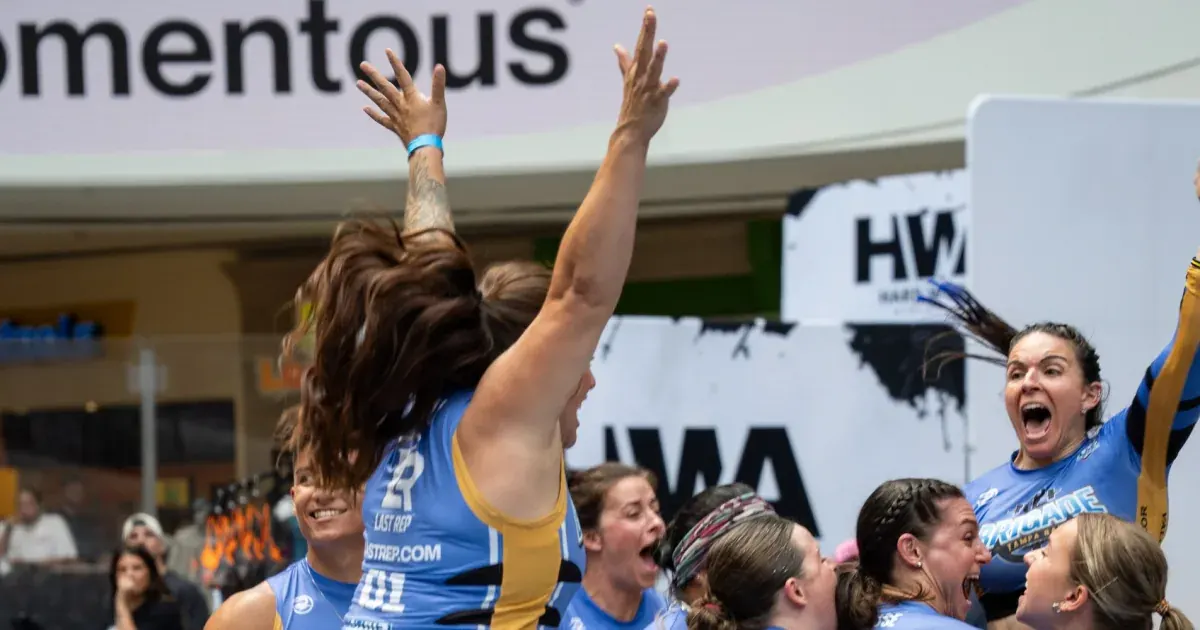 Tampa Bay Brigade athletes celebrate with arms raised at United Grid League Week 3 at American Dream.
