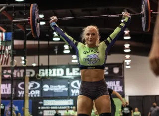 Kelsey Kiel of the SWFL Sharks locks out a barbell overhead during a Grid League match