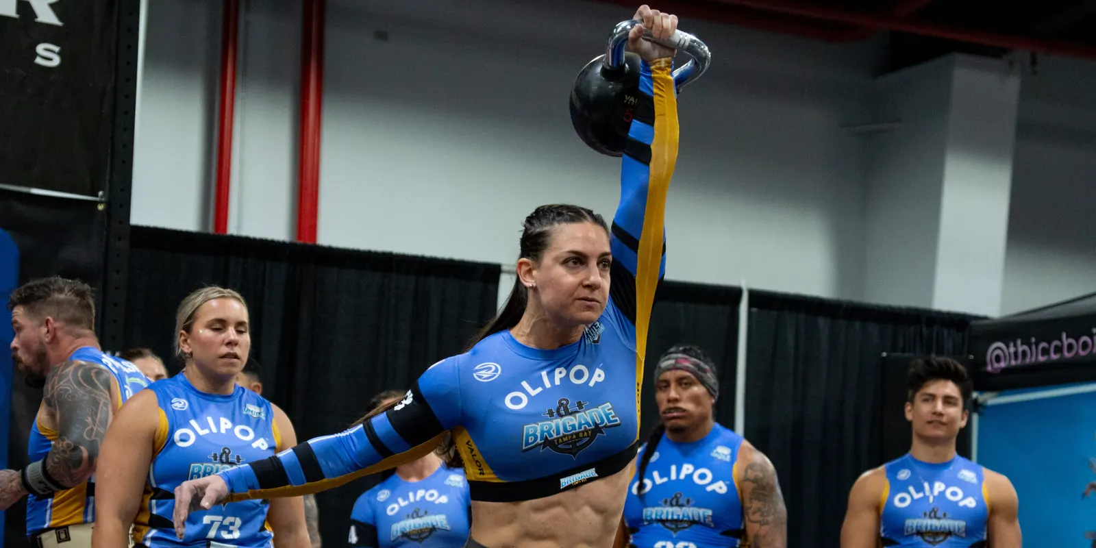 Tampa Bay Brigade player locks out a kettlebell during a Grid League race