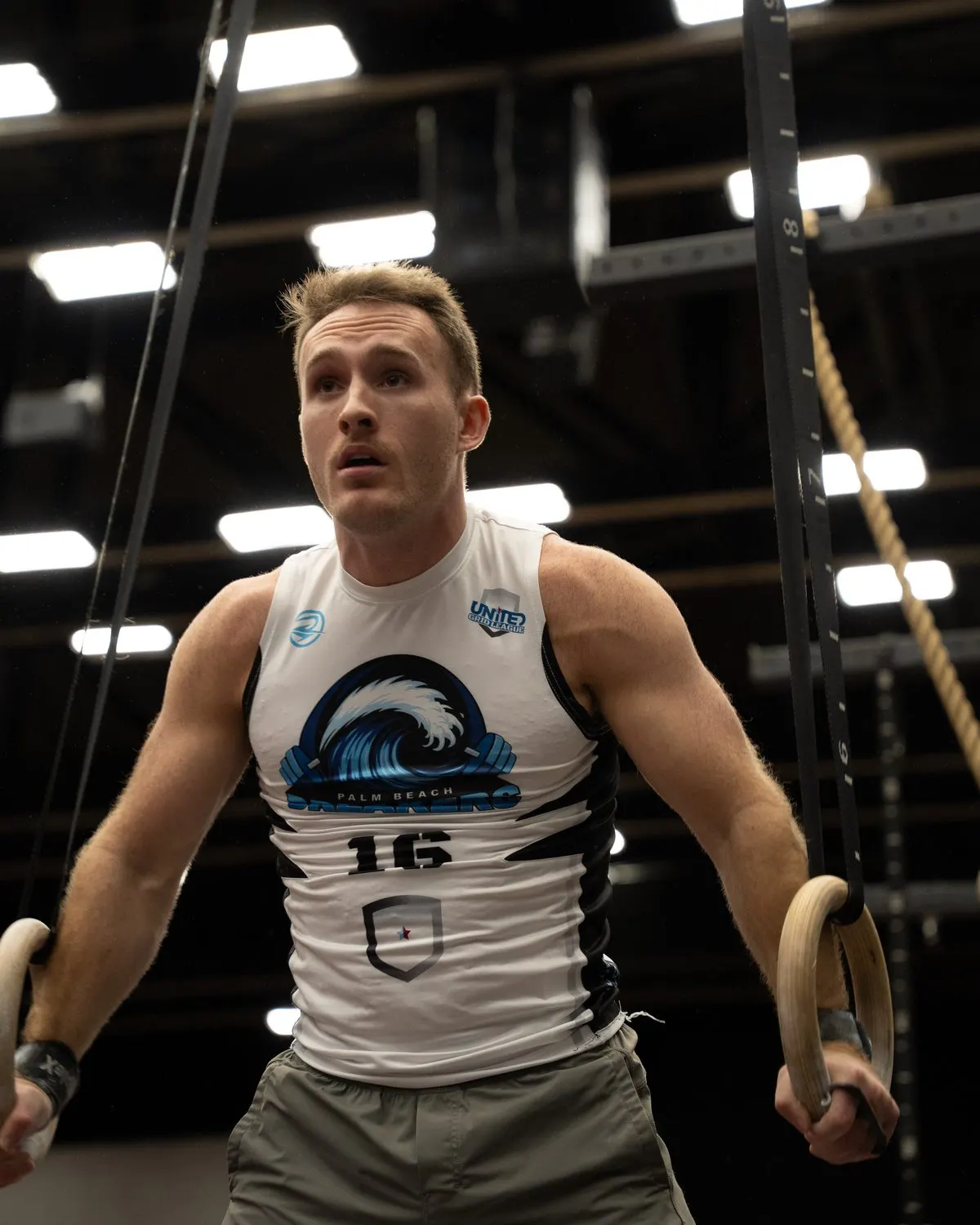 Palm Beach Breakers player at the top of a ring muscle-up during the Echo