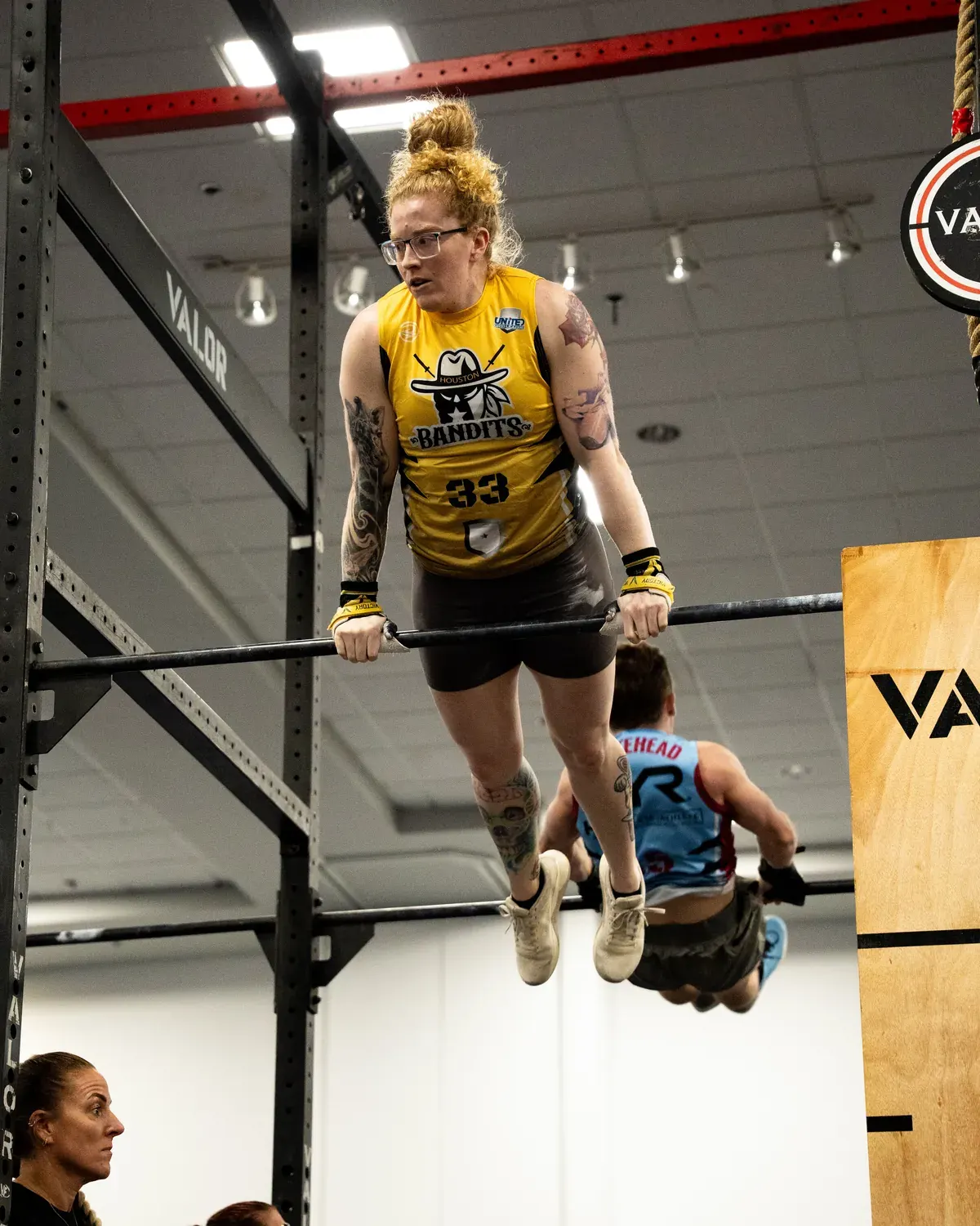 Houston Bandits player Ellia Miller locked out on top of the bar in a bar muscle up in Lakeland