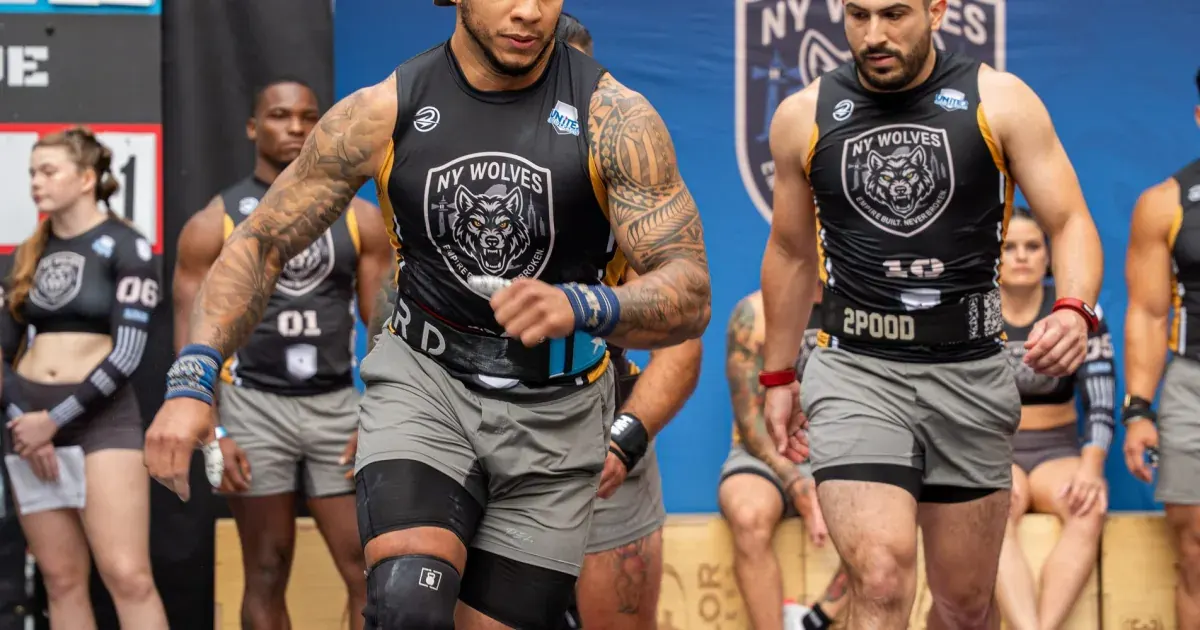 New York Wolves athletes walk onto the competition floor at United Grid League Week 3 at American Dream.
