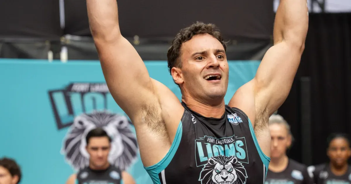 A Fort Lauderdale Lions athlete raises both arms in celebration at United Grid League Week 3 at American Dream.