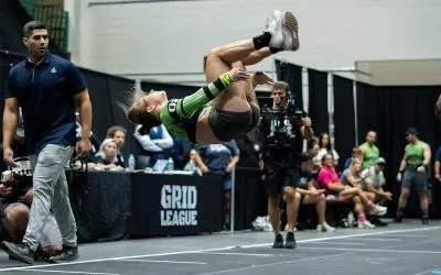 Grid League player mid-backflip in competition