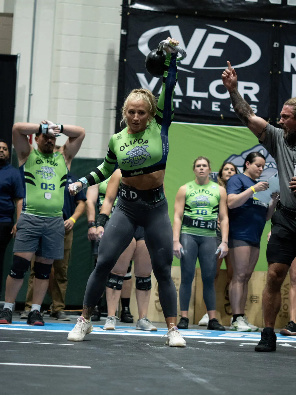 Kelsey Kiel locks out a kettlebell overhead during a Grid League match.