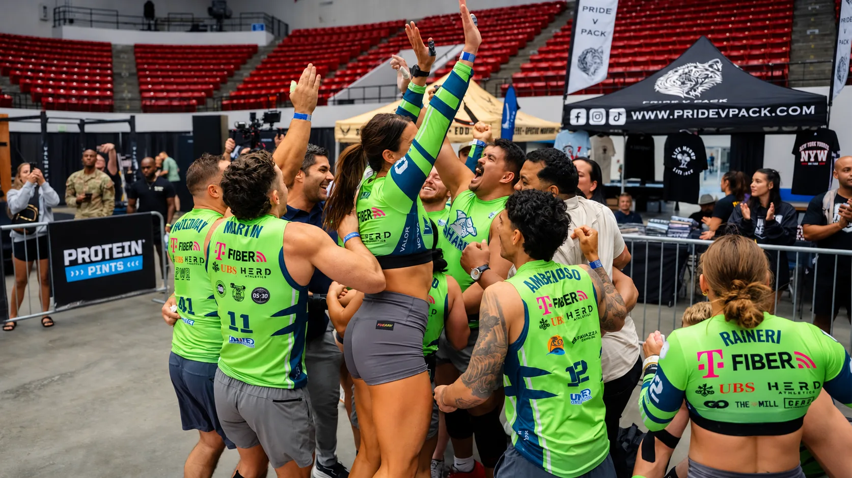 Sharks players and staff celebrating together in a huddle